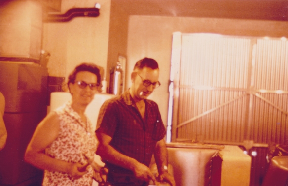 Grandma and Grandpa working in the upholstery shop.